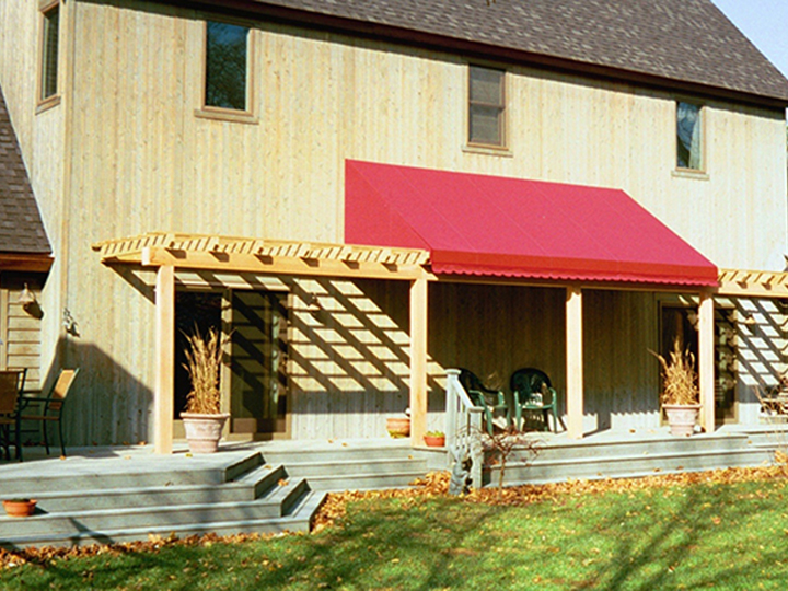Large red awning over residential patio
